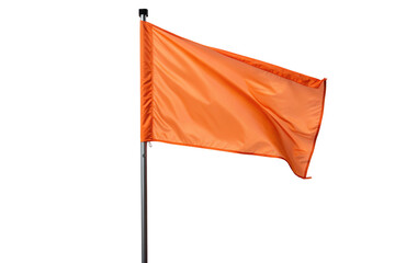 Bright orange fabric flag waving on shiny metal pole isolated against black background image