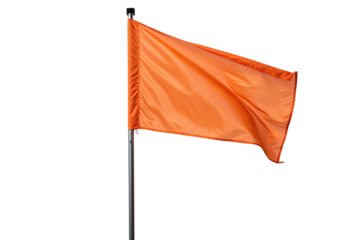 Bright orange fabric flag waving on shiny metal pole isolated against black background image