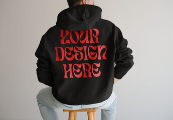 Mockup Of Man Wearing Customizable Hoodie, Rear View