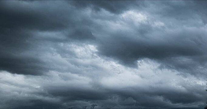 Time lapse of storm clouds forming before thunderstorm and lightning