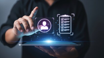 Man holding tablet with glowing profile and checklist icons in dark room, concept of digital resume screening and applicant tracking