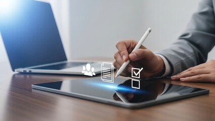 Person in light gray suit using stylus on tablet with holographic people documents and checkboxes icons, concept of applicant tracking and resume automation