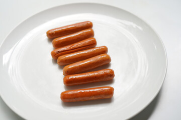A plate of sausages on white background