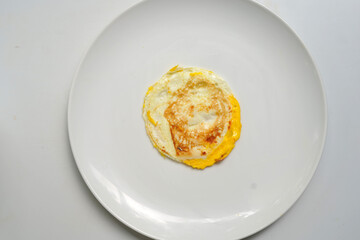 Omelet on plain white dish image