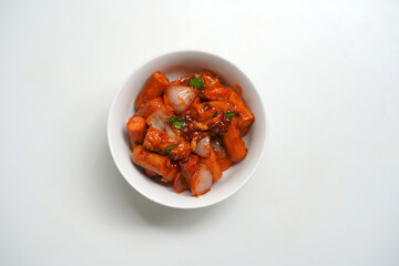Hot and Spicy Devil Sausage Dish in White Bowl.