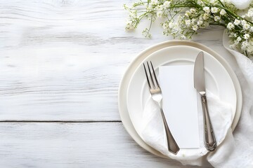 Elegant table setting with white plates, flowers, and rustic wooden background