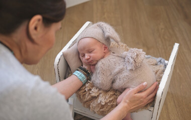 Photographer Backstage With Newborn Posing For Photoshoot