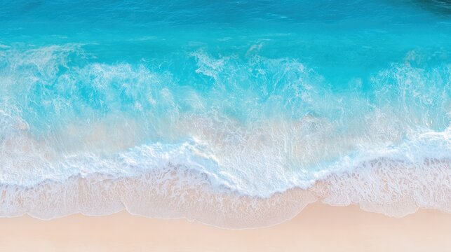 Aerial view of pristine shoreline with turquoise waters and white sandy beach, showcasing tropical seascape beauty.