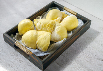 A yellow durian that has been peeled off to reveal the tasty yellow flesh of the durian. Durian...