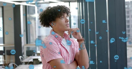 Sale and currency icons fading into view and guiding professional analyzing finance data in office - Powered by Adobe