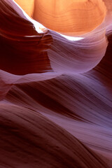 Obraz premium Narrow canyon passage with vibrant red and orange rocks