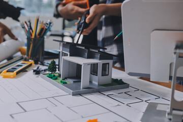 Construction and structure concept of engineer working drawing on blueprint meeting for project...