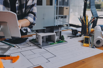 Construction and structure concept of engineer working drawing on blueprint meeting for project...