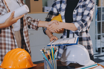 Construction and structure concept of engineer working drawing on blueprint meeting for project...