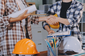 Construction and structure concept of engineer working drawing on blueprint meeting for project...