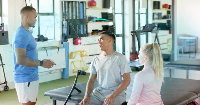 Therapist tapping tablet demonstrating biometric scan fingerprint as patient prepping exercise