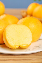 Fresh Golden Peach Butter Steamed Buns on White Plate - Traditional Asian Bakery Food