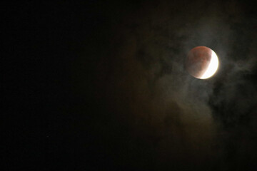 A beautiful rare blood moon on a dark night sky