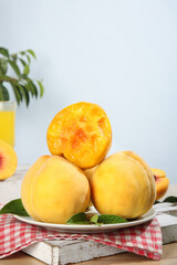Fresh Yellow Peaches from Shanghai Fengxian District on Red Checkered Cloth