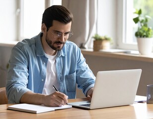 Obraz premium Young Brazilian Professional Focused on Online Learning at Home Office