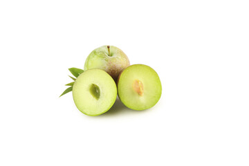 Fresh Green Plums Whole and Halved with Leaves on White Background
