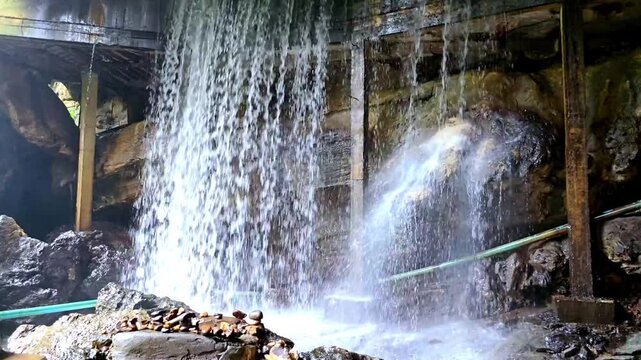 Cool, clear waterfall in the middle of the forest