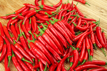Freshly Picked Red Hot Chili Peppers on Wooden Board - Spicy Cooking Ingredients