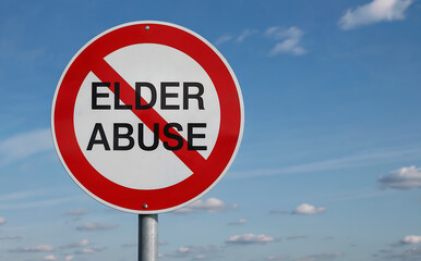Red prohibition sign with text Elder Abuse against blue sky white circle