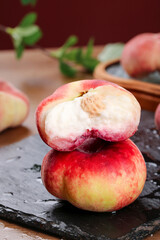 Fresh Flat Peaches from Shaanxi China Cross Section on Slate Board
