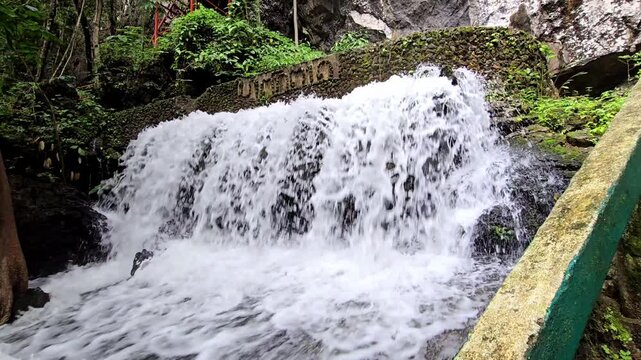 Cool, clear waterfall in the middle of the forest