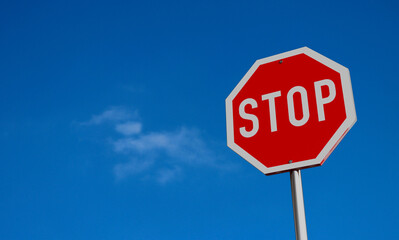 Desert Stop Sign under Blue Sky