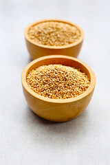 Raw quinoa seeds in a bowl.