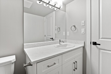 Bathroom with a white sink and toilet
