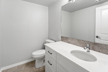 Bathroom with a white toilet and sink