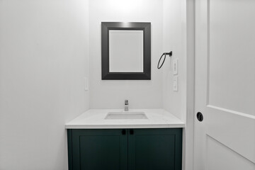 Small bathroom with a black sink and a mirror