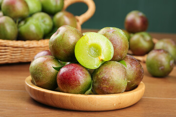 Fresh Ripe Plums in Wooden Bowl - Healthy Organic Stone Fruit Harvest Display