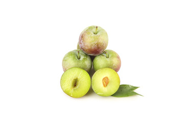 Fresh Green Plums Whole and Halved with Leaves on White Background