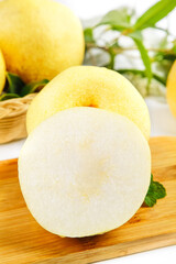 Fresh White Dangshan Pears from Anhui China Sliced on Wooden Board with White Background