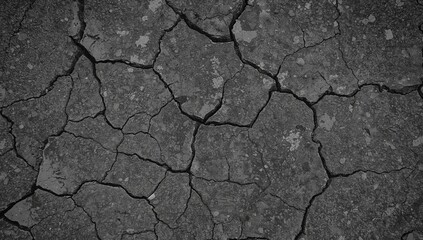 Obraz premium Fractured Surface. A Study in Textures and Light Patterns Across Arid Landscapes.