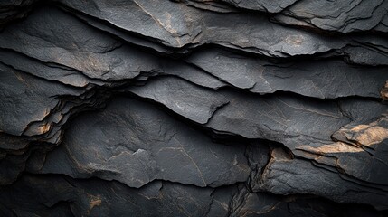 Dark, layered rock texture