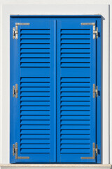 A full-frame, close-up shot of a pair of bright blue window shutters, framed by a clean white wall