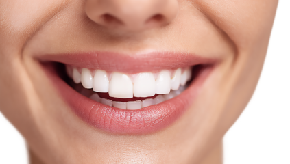Close up of a smiling woman showing her perfect white teeth and lips isolated on transparent background