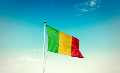 Mali national flag waving in beautiful sky with mast. A proud moment flag waving with sunlight.