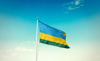 Rwanda national flag waving in beautiful sky with mast. A proud moment flag waving with sunlight.