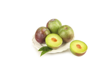 Fresh Ripe Plums Closeup with Halved Fruit on White Plate - Healthy Organic Stone Fruit