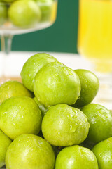 Fresh Green Plums with Water Droplets on Colorful Background - Healthy Organic Fruit Photography
