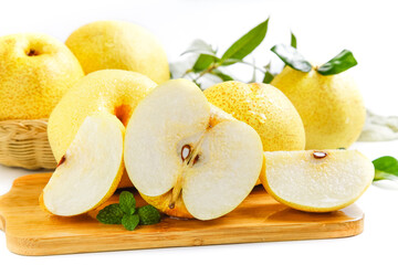 Fresh Yellow Pears Sliced on Wooden Board with Green Leaves White Background