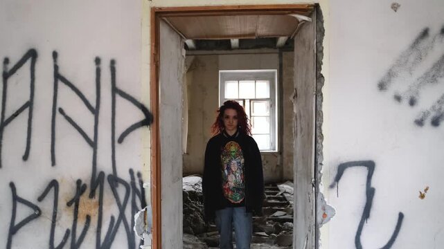 A lonely, depressed girl with wild red hair is in an abandoned building. A homeless teenage girl ran away from home because of problems