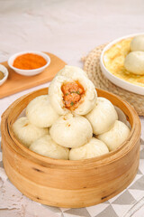 Fresh Xiaolongbao Chinese Soup Dumplings with Meat Filling in Bamboo Steamer Basket