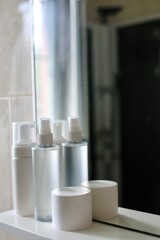 Cosmetics on the bathroom shelf. Care products. Beauty care products. Bathroom. Everyday care. 
